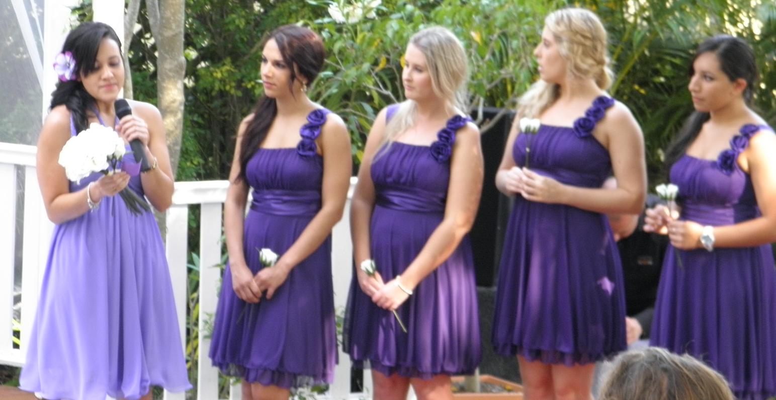 Mt Ommaney Hotel Wedding. Bridesmaids dressed in purple as the Maid of Honour performs a reading.