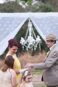 The couples children kissing the wedding bands to signify their blessing of the marriage...for the second time!