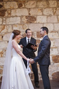 Brisbane Celebrant Jamie Eastgate pronouncing the couple as husband and wife at Old Government House. Image: Kwintowski Photography